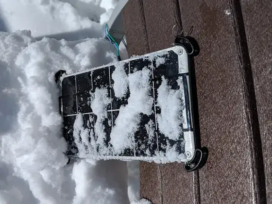 The monitoring hardware caked in snow after a storm